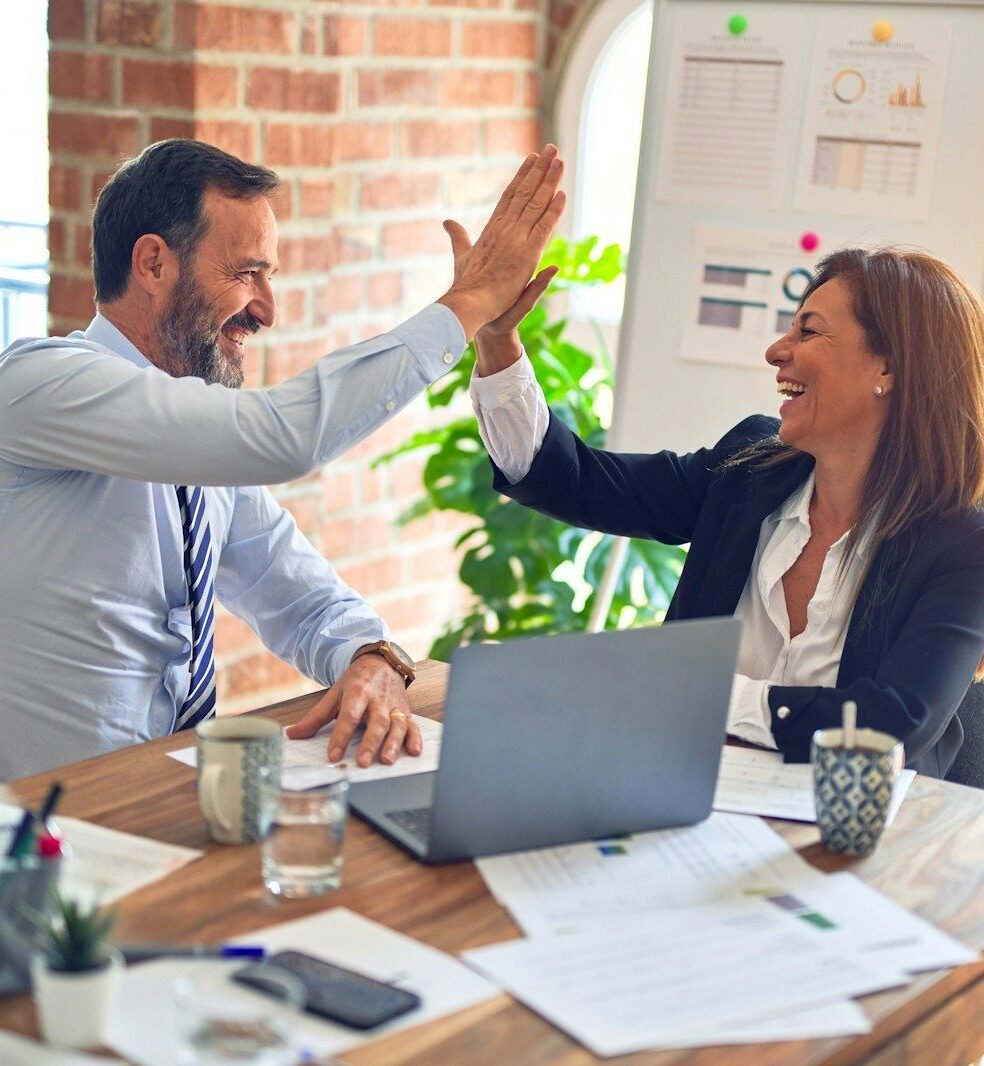 Photo by krakenimages man in white dress shirt sitting beside woman in black long sleeve shirt